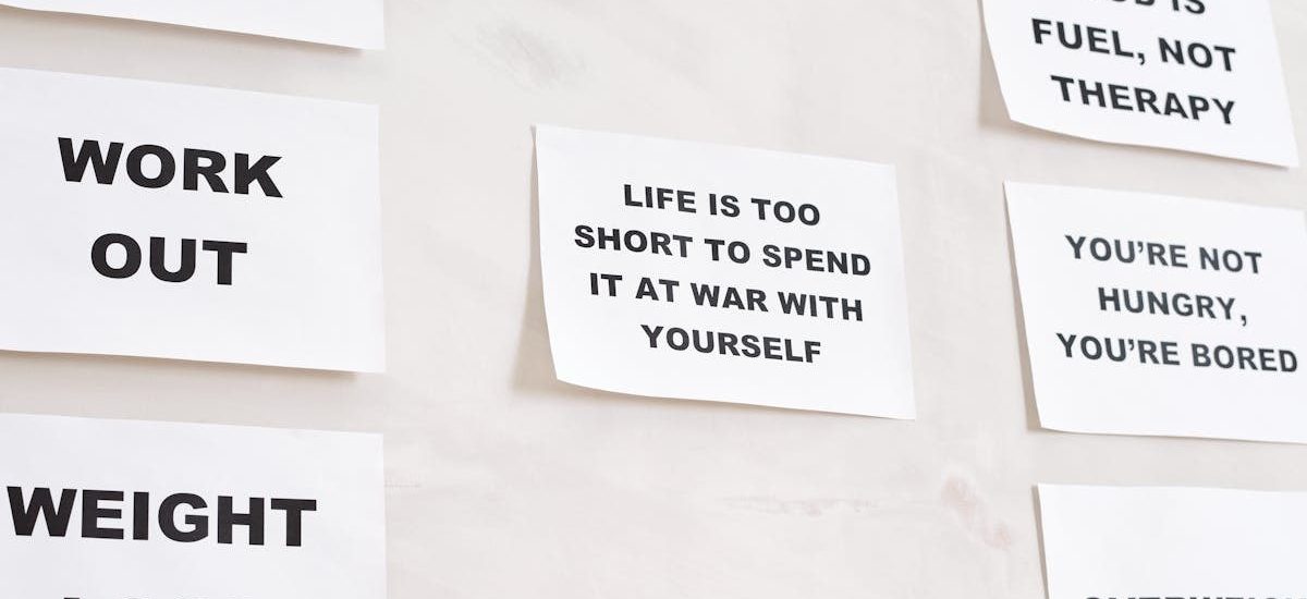 Motivational quotes on white paper promoting healthy habits and lifestyle changes.